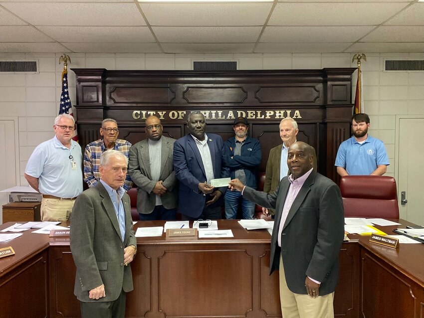 Pictured are front, from left, David Carter and Johnny Beckwith (Back) Ward 2 Alderman Jim Fulton, Ward 3 Alderman James Tatum, Ward 4 Alderman Shaun Seales, Mayor James A. Young, Ward 1 Alderman Justin Clearman, Alderman-At-Large James Waltman, and City Attorney Robert Lee Thomas.